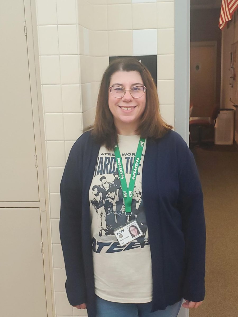 Mrs. Clague standing at her classroom door.