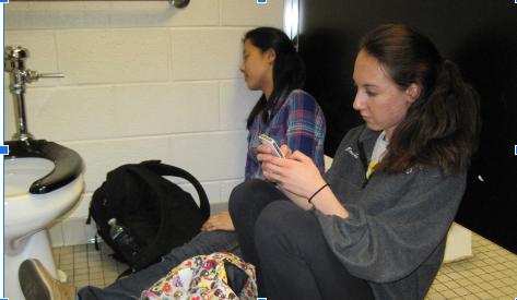 Students skipping class in the bathroom.